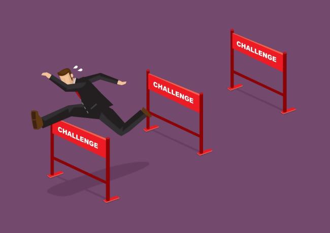 Corporate Worker Jumping Hurdles 