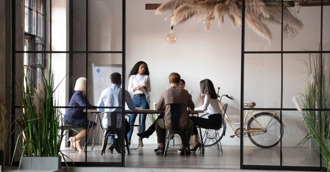 9 Tips for Building a Business Case for Outsourcing Diverse work group in conference room